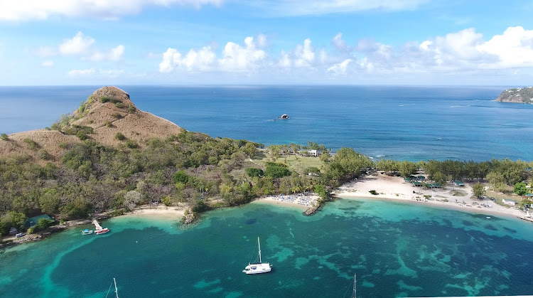 The blue Atlantic to the north and turquoise Rodney Bay at Pigeon Island, a national park in the north of St. Lucia. 