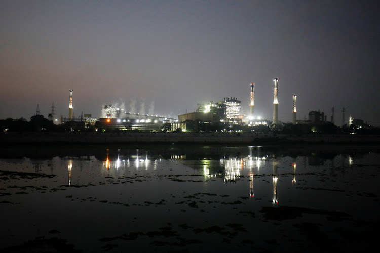 Smoke billows from the cooling towers of a coal-fired power plant in Ahmedabad, India, October 13 2021. Picture: REUTERS/AMIT DAVE