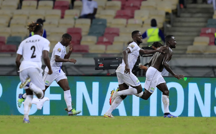 Sierra Leone's Alhaji Kamara celebrates scoring their second goal against Ivory Coast with teammates.