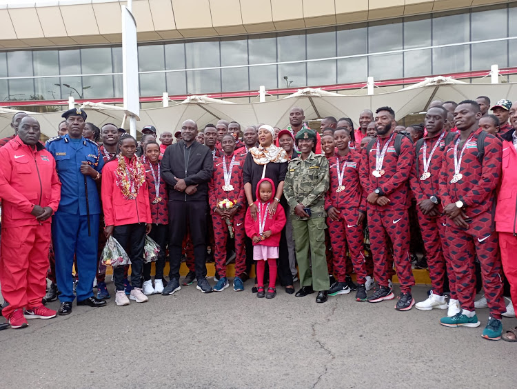 Cabinet Secretary for Sports Amina Mohamed and Sports PS Joe Okudo receive Team Kenya at the Jomo Kenyatta Airport upon arrival from Mauritius, where they emerged top at the Senior African Athletics Championships