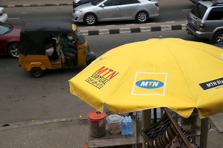 The logo of MTN telecommunication company is seen printed on an umbrella at a call point along a road in Lagos, Nigeria. File Photo