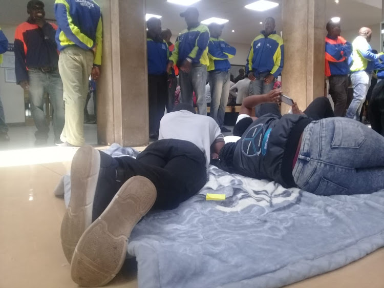 Wits students sleeping inside a hall on campus.