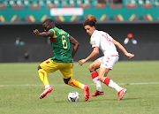 Mali's Massadio Haïdara is challenged by Hannibal Mejbri of Tunisia in the 2021 Africa Cup of Nations match at Stade Municipal de Limbe in Limbe, Cameroon, on January 12 2021.