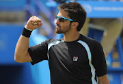 Janko Tipsarevic of Serbia celebrates winning his semifinal against Kei Nishikoro of Japan during day 8 of the AEGON International tennis tournament on June 18, 2011 in Eastbourne, England