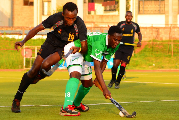 Greensharks' Abraham Mumo (R) shields the ball from Strathmore's Lamek Kibet during their KHU league match at City park on October 27,2019.