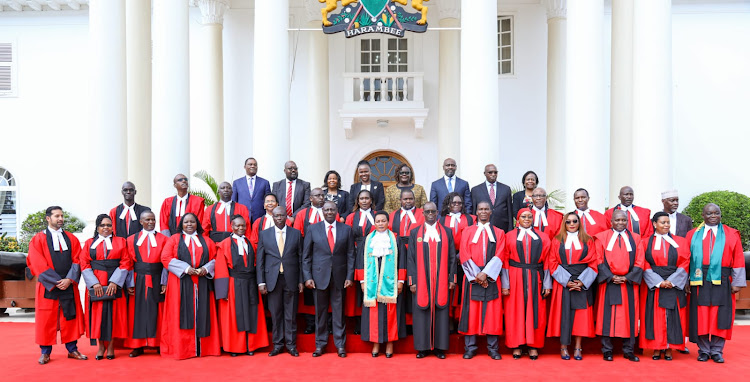 President William Ruto and the 20 newly sworn in High Court judges at State House on December 7,2022