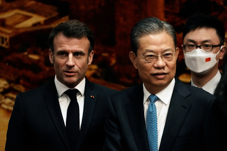 France's President, Emmanuel Macron, and Zhao Leji, the head of the National People's Congress, arrive for a meeting at the Great Hall of the People, in Beijing, China, Thursday, April 6 2023. Picture: REUTERS