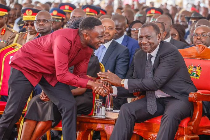 Joel Ogolla shakes hand with President William Ruto during the funeral service on April 22, 2024.