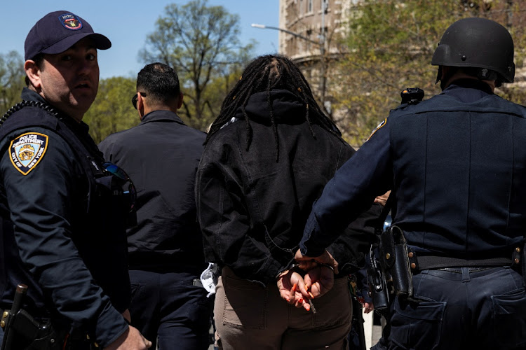 A demonstrator is detained by police outside Columbia University campus in New York City, the US, April 22 2024. Picture: REUTERS/CAITLIN OCHS