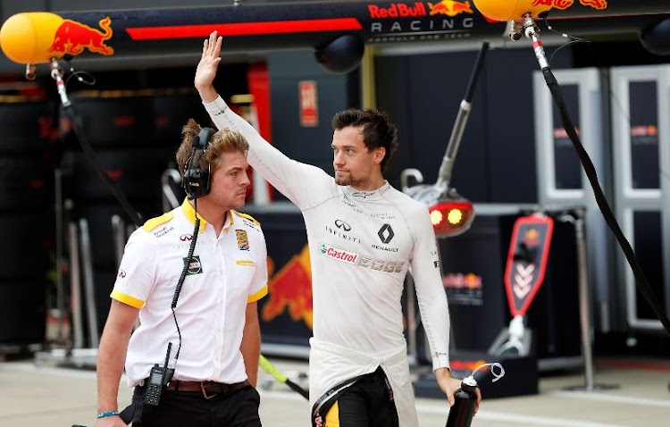 Renault's Jolyon Palmer waves to the fans during qualifying.