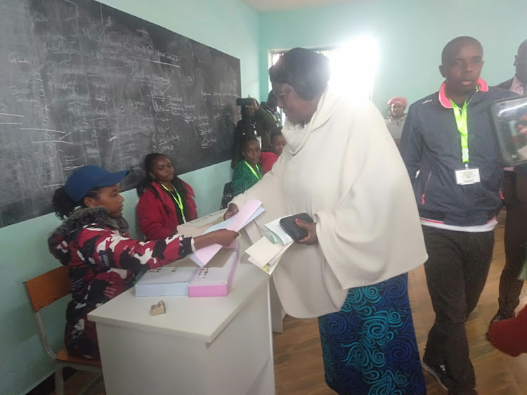 Mama Ngina Kenyatta casts her vote at Mutomo Primary School, Gatundu on Tuesday, August 9.