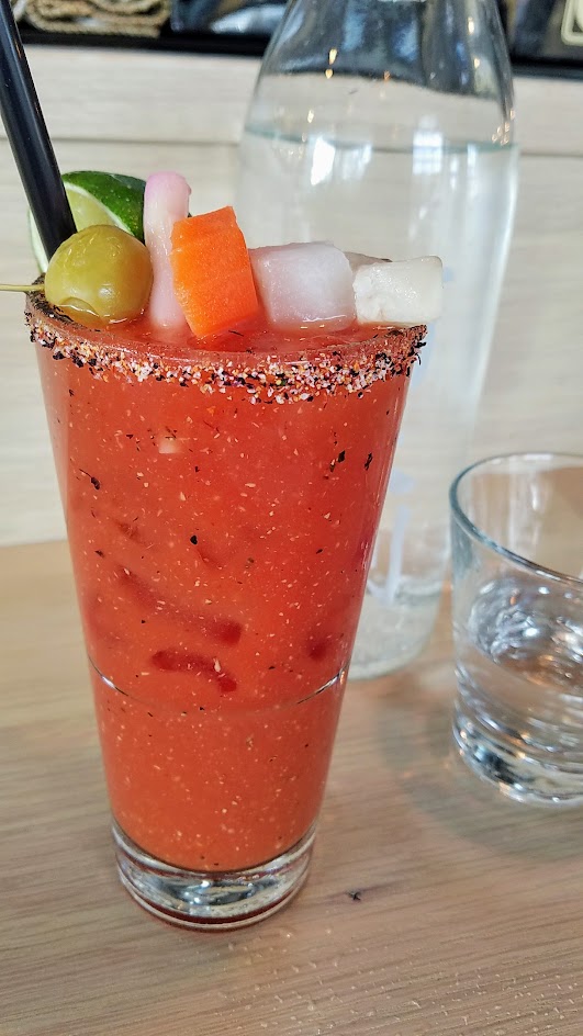 Afuri Akai Chi, a bloody mary with house white miso, horseradish, ponzi, and pickled skewer that includes a bit of fish (vegetarian option available, just ask)