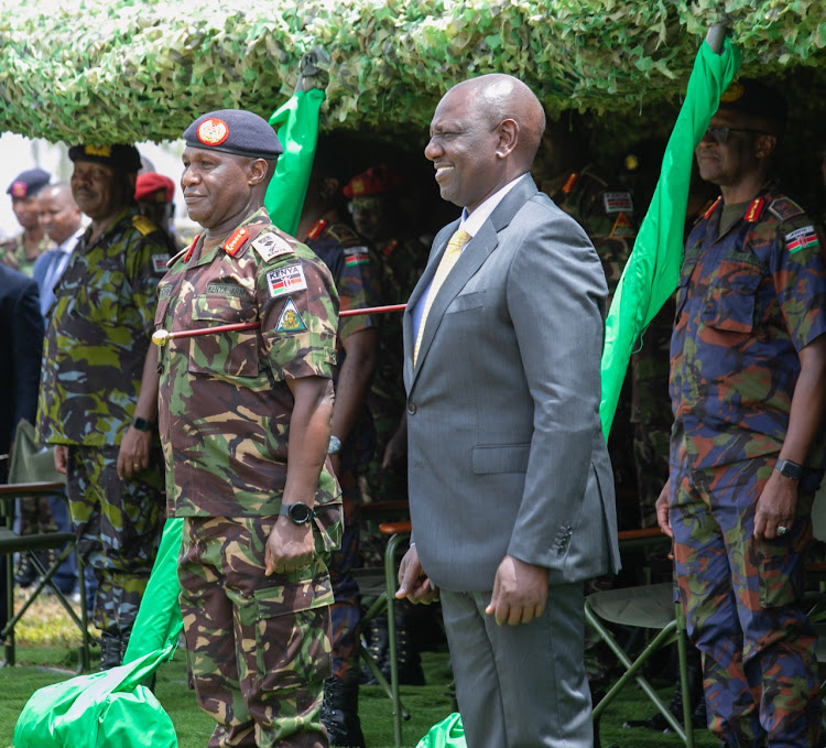 President William Ruto officially hands over the East African Community Regional Force flag to the team sent to DRC for peacekeeping on November 2, 2022.