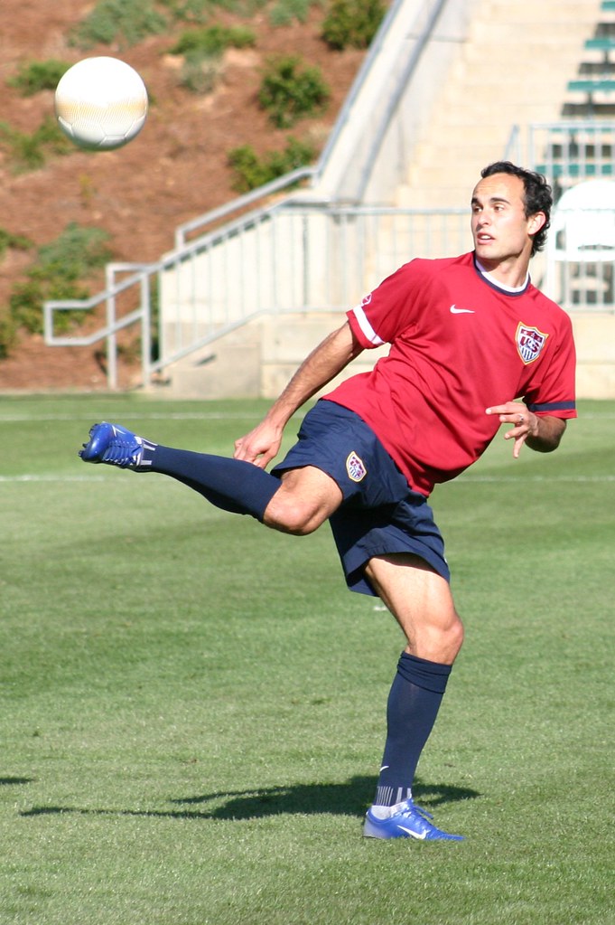 Juggle a soccer ball - a player flicking the ball with his heel