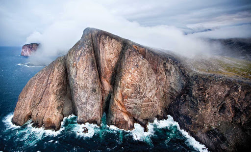 A sheer rock face at Torngats Mountains in northern Newfoundland and Labrador Province, Canada.