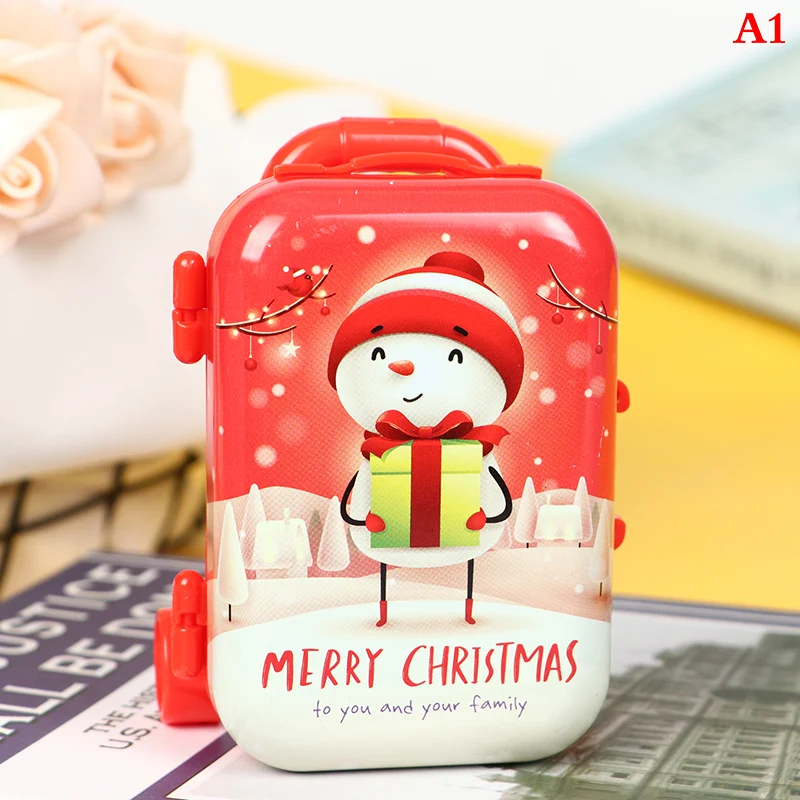 Porte-monnaie de Noël en forme de valise trolley en fer blanc. Parfait pour ranger pièces et petits objets, idéal comme cadeau de Noël.