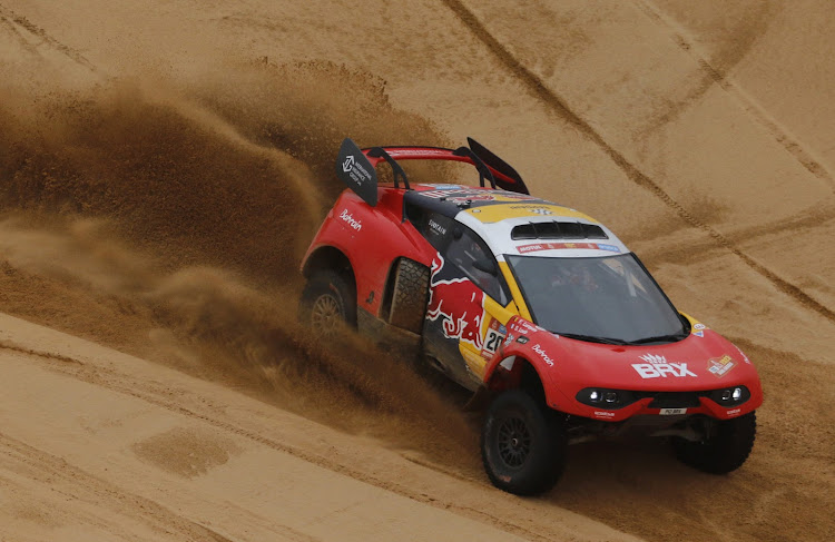 Bahrain Raid Xtreme's Sebastien Loeb and co-Driver Fabian Lurquin in action during stage 8.