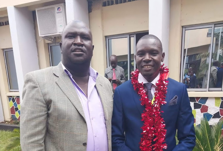 Paul Olunga Ekweny, CeC nominee for Sports, Culture and Social Services docket with county assembly deputy speaker Ronald Ochalu on October 17