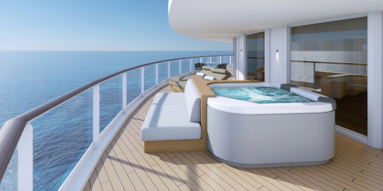 A hot tub on the balcony of a Haven Suite overlooking the ocean.