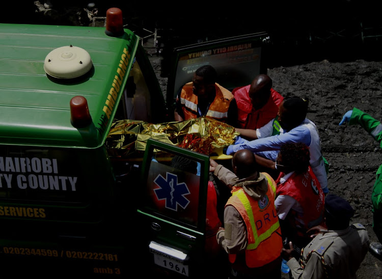 A survivor rescued from the Tassia six-storey building is taken into an ambulance for First Aid on Friday, December 6, 2019.