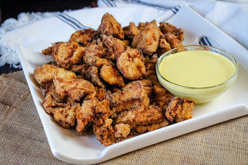 A platter of Chicken Bites With Honey Mustard.