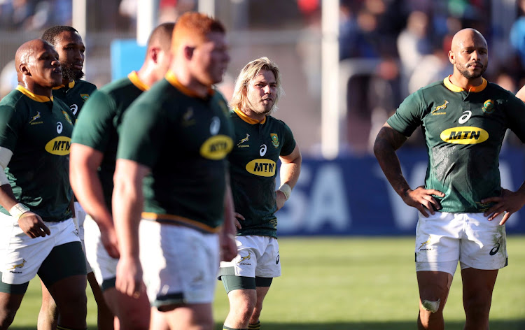 South Africa's Faf de Klerk (C) and teammates react at the end of the Rugby Championship match at Malvinas Argentinas Stadium in Mendoza on August 25, 2018.