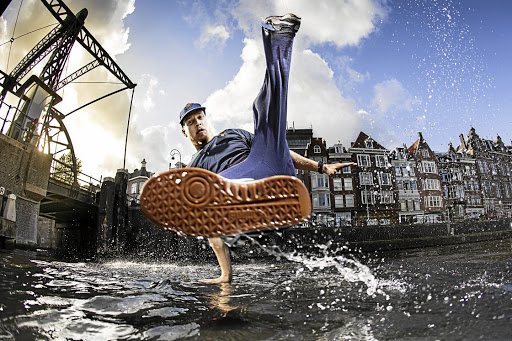 Red Bull BC One 2017 world champion Menno van Gorp (aka b-boy Menno) dancing on a canal in Amsterdam.