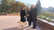 Moldova's President Maia Sandu and her dog greet Austria's President Alexander Van der Bellen and Slovenia's President Natasa Pirc Musar in Chisinau, Moldova November 16, 2023, in this handout picture. 