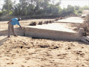 NO WAY OUT: Motorists from GaNtata village can no longer use the Molototsi River bridge because it was swept away by the recent heavy rains. PIC: MICHAEL SAKUNEKA. 07/12/2009. © Sowetan.