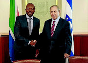 Israeli President Benjamin Netanyahu (here with South African opposition leader Democratic Alliance leader Mmusi Maimane) was reelected to that country's highest office on Wednesday.