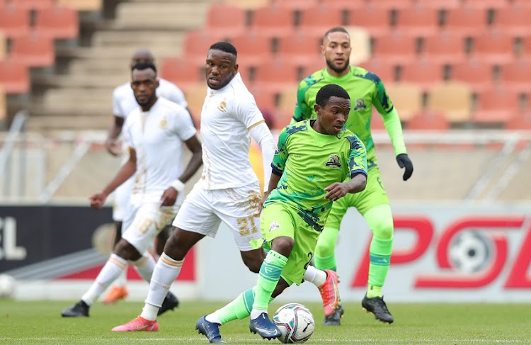 Ndabayithethwa Ndlondlo of Marumo Gallants challenged by Victor Letsoalo of Royal AM during the DStv Premiership match between Marumo Gallants FC and Royal AM at Peter Mokaba Stadium on October 19, 2021 in Polokwane, South Africa.