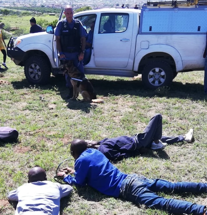 UNDER ARREST: Three thieves were caught while removing support iron beams from an electricity pylon in Bethelsdorp. Pictures: SUPPLIED