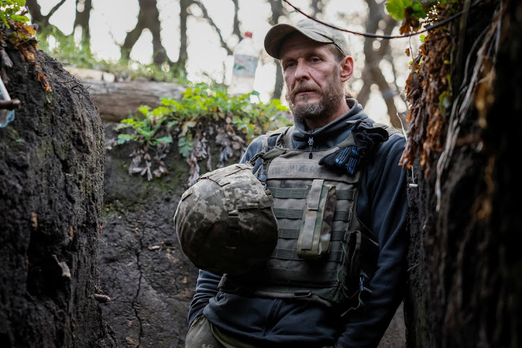 Serviceman of an artillery unit of the Armed Forces of Ukraine Valerii stands in a trench in a position near a front line in Donetsk region, Ukraine, November 4 2023. Picture: ALINA SMUTKO/REUTERS