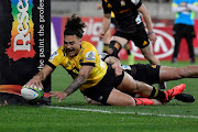 Peter Umaga-Jensen of the Hurricanes crosses to score a try during the round 9 Super Rugby Aotearoa match between against the Chiefs at Sky Stadium in Wellington, New Zealand on August 8, 2020.