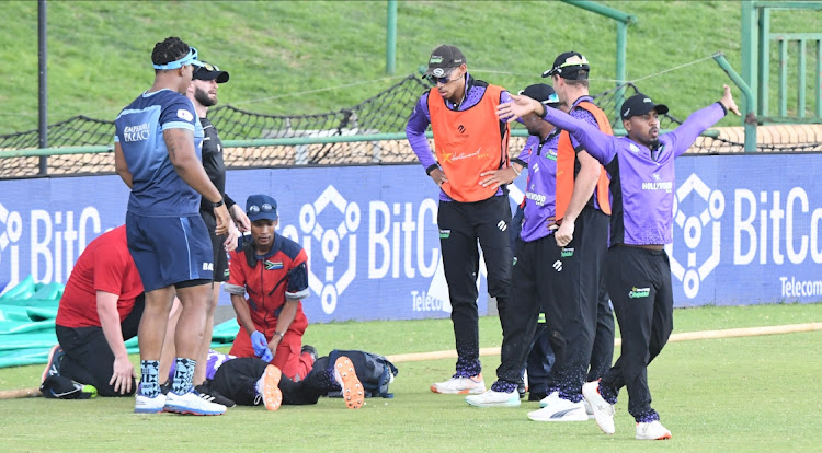 Keegan Petersen of the Dolphins is given medical attention after an apparent injury incurred in his endeavor to stop a boundary during the CSA T20 Challenge final match between Momentum Multiply Titans and Hollywoodbets Dolphins at JB Marks Oval on November 05, 2022 in Potchefstroom.