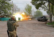 Service members of pro-Russian troops fire from a tank during fighting in Ukraine-Russia conflict near the Azovstal steel plant in the southern port city of Mariupol, Ukraine, on May 5 2022. 