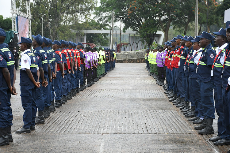 Private security guards mount a parade at Uhuru park during the mass registration exercise on March 30, 2024