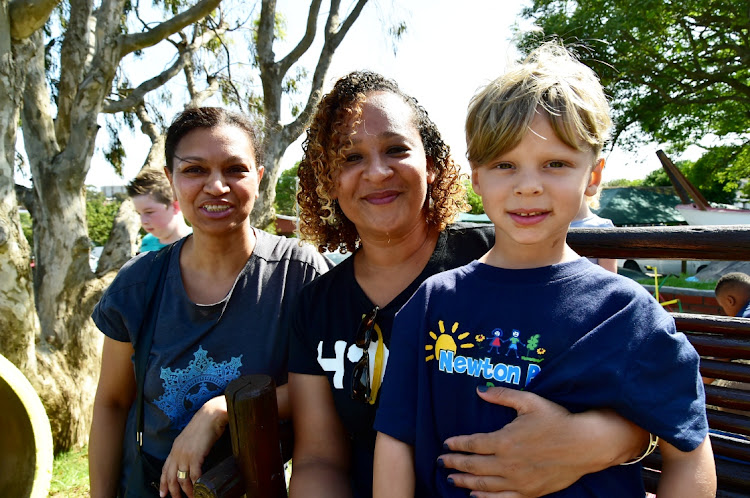 Tamryn Lamour, left, with Keena Lamour, 5, and Tracy Galloway have a giggle at the Newton Pre-Primary’s 60th birthday celebration at the school on Saturday