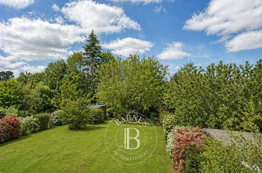 Large green garden with mature trees in this luxury property for sale in Les Loges-en-Josas ($1,509,995 - 230 m²)
