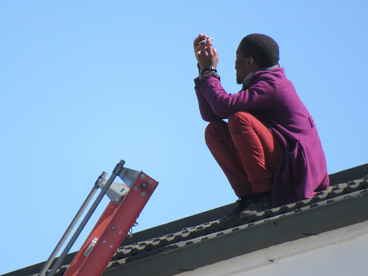Eastern Cape police saved an escaped detainee after the man threatened to commit suicide by jumping off the top of a building.