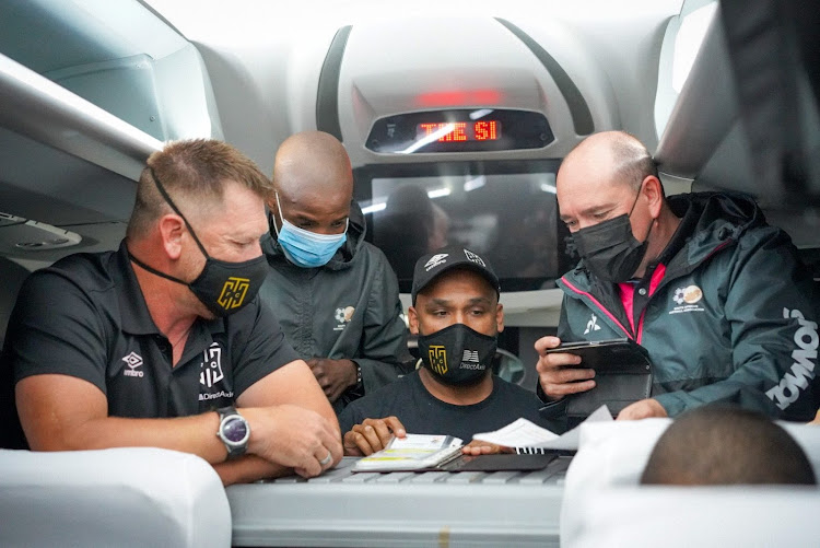 Cape Town City coach Eric Tinkler (left) and his technical staff go through last-minute planning on the team bus on their way to FNB Stadium for the DStv Premiership match against Kaizer Chiefs on December 4 2021. City, however, found themselves locked out of the stadium.