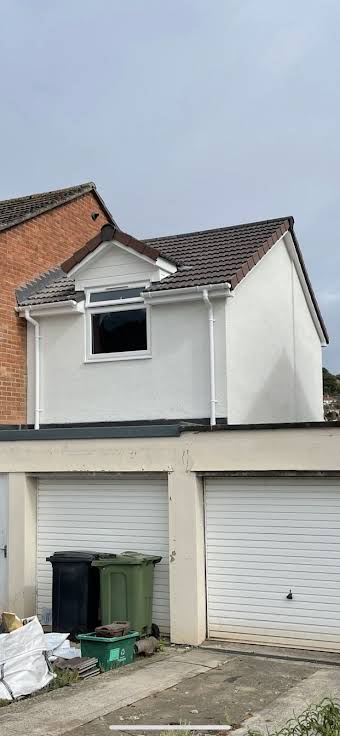 Double storey timber frame extension using previous garage shell  album cover