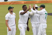 Proteas players celebrate the wicket of Cheteshwar Pujara of India by Lungi Ngidi during day one of the Boxing Day Test at SuperSport Park on Sunday. 