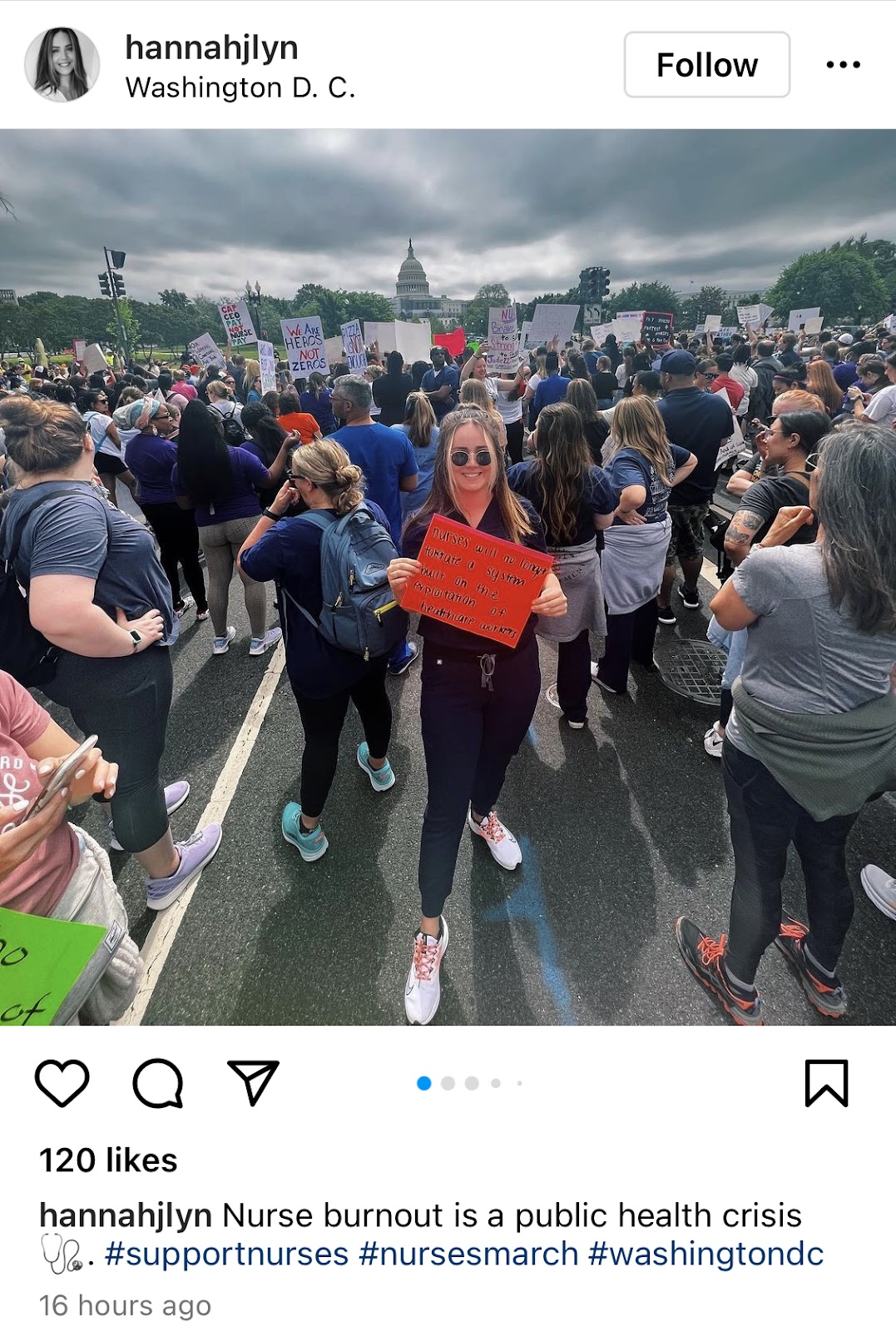 Girl poses with red sign