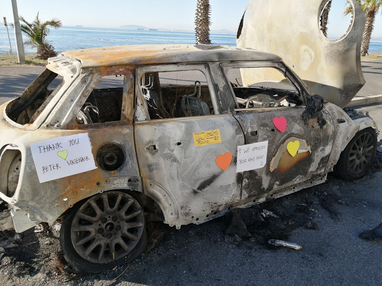 Peter Wagenaar's burnt-out car now attracts admirers.