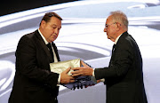 Steve Hansen receives a special award from Brett Impey, New Zealand Rugby chairman during the New Zealand Rugby Awards at the Sky City Convention Centre  in Auckland on December 12, 2019.