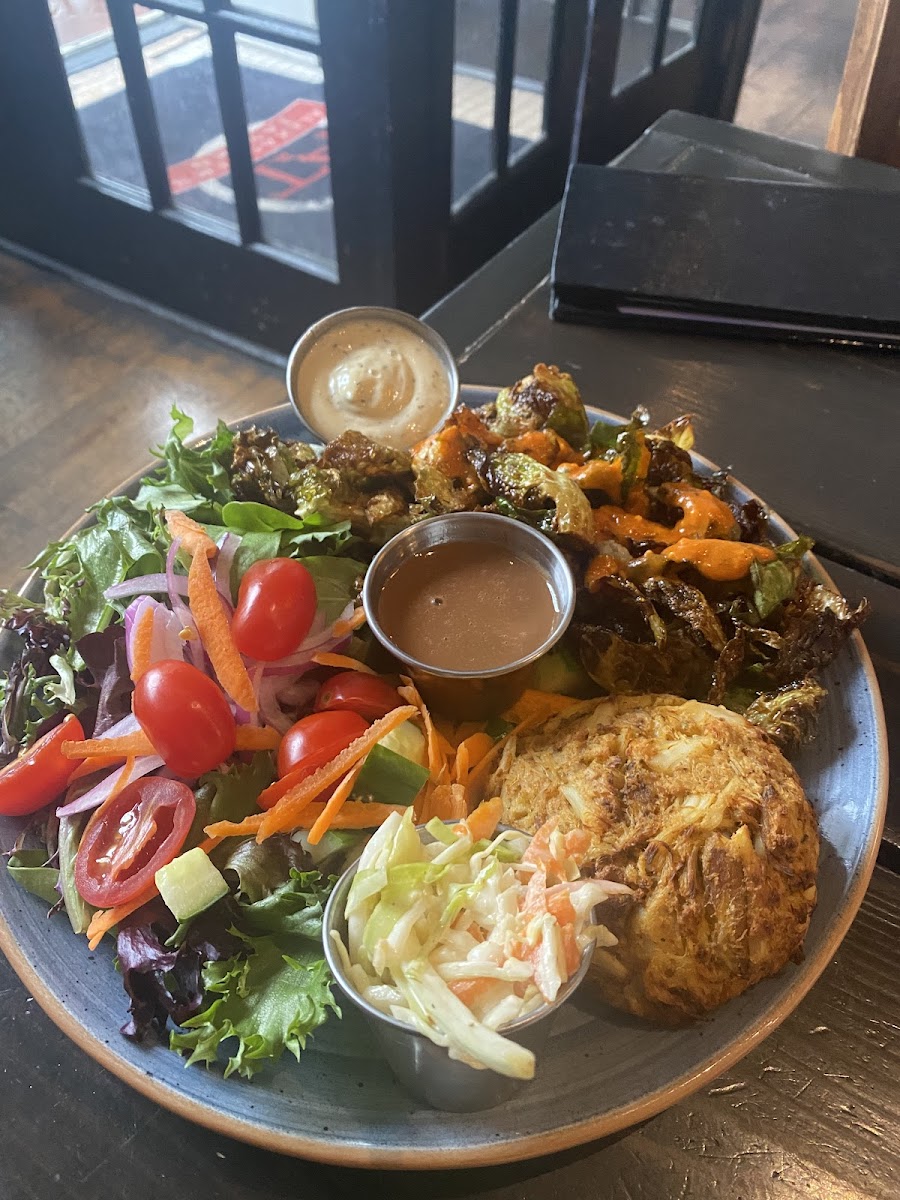 Crab cake dinner wirg buffalo brussel aprouts and salad.