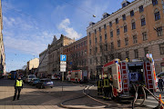 Firefighters respond to a deadly fire in a hostel in Riga, Latvia, on April 28 2021. 