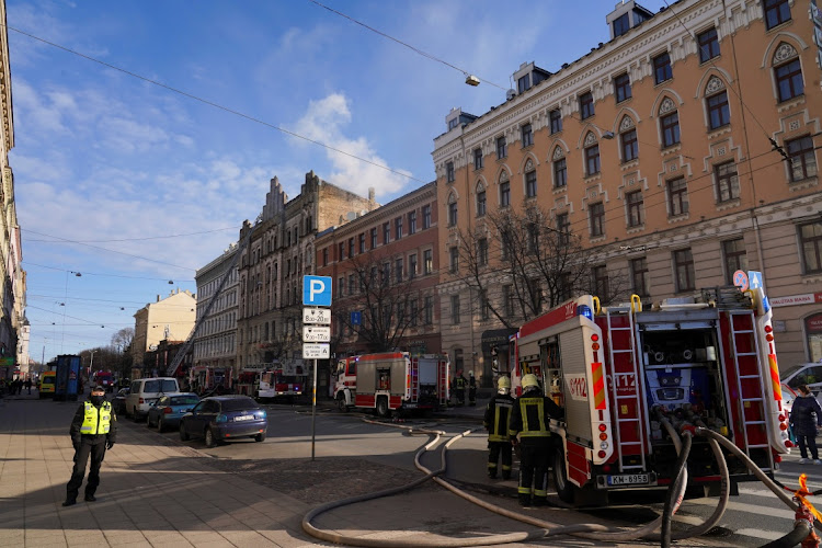 Firefighters respond to a deadly fire in a hostel in Riga, Latvia, on April 28 2021.