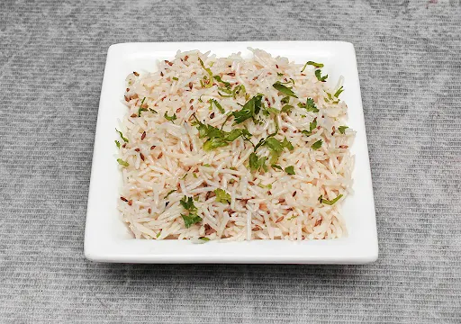 Jeera Rice Served With Gravy Or Raita
